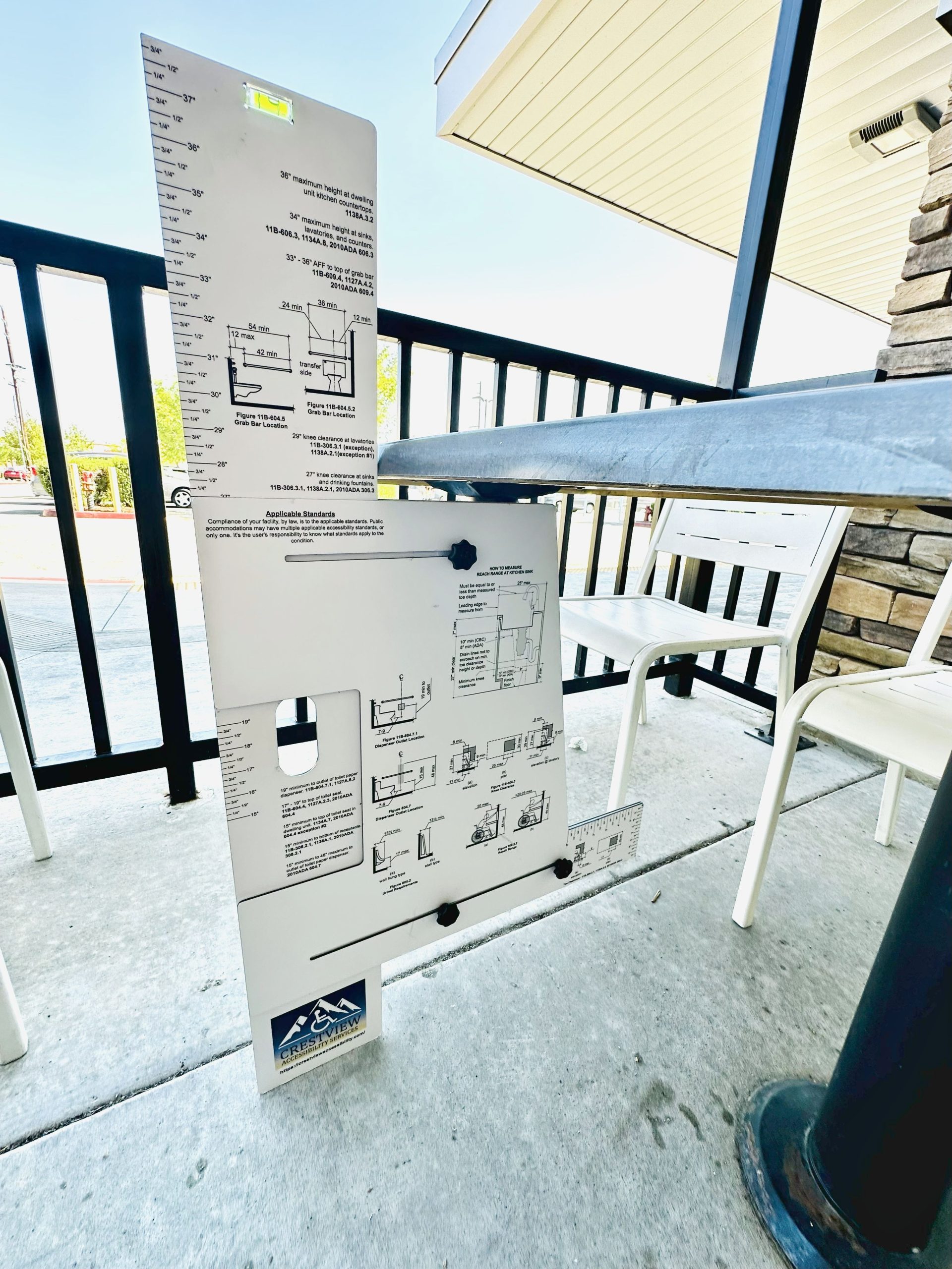Device for measuring accessibility clearances and reach ranges.