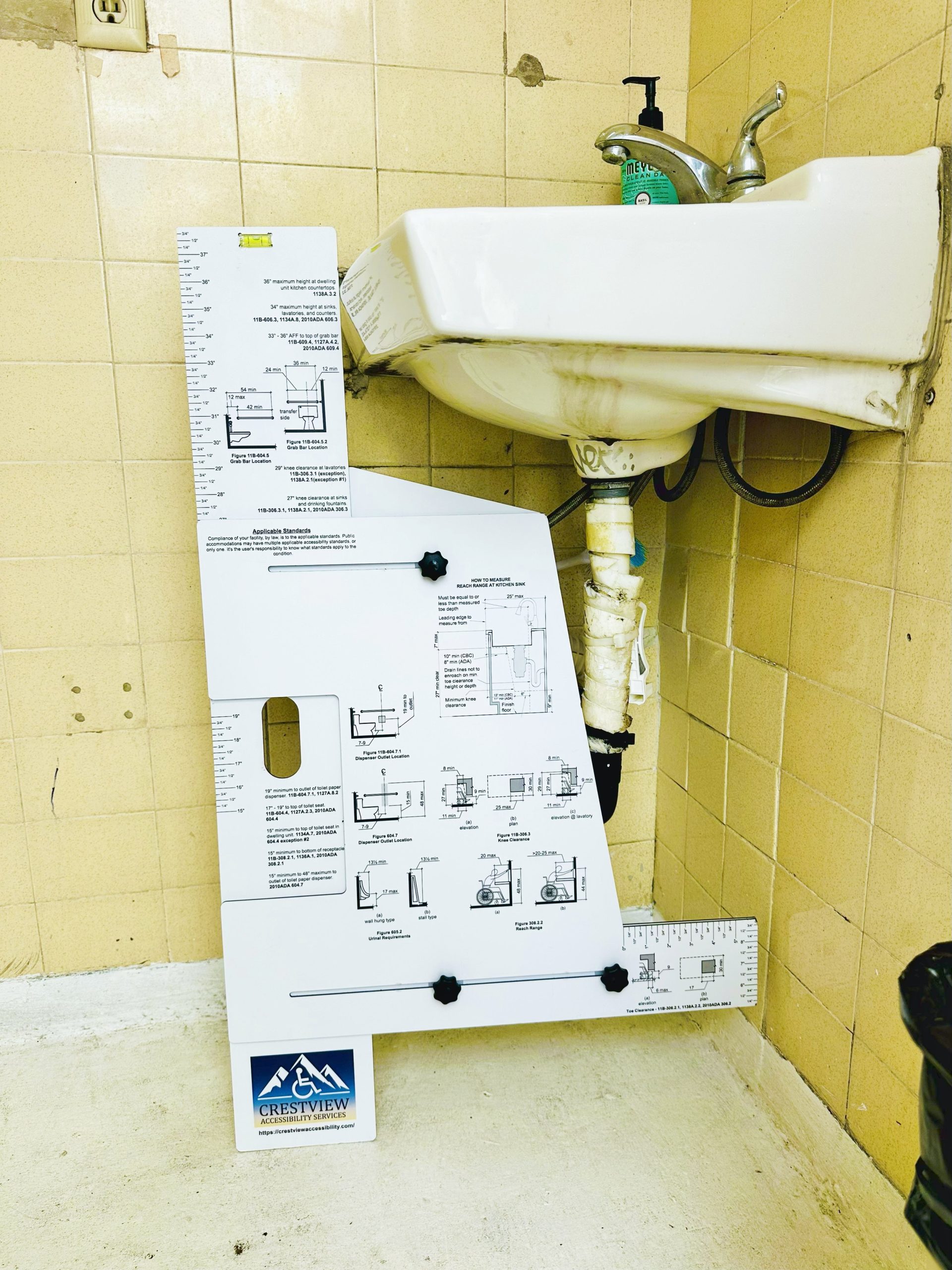 Device for measuring accessibility clearances and reach ranges.